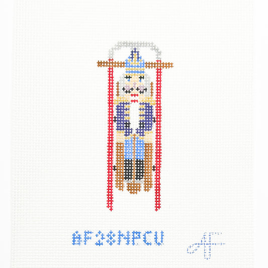 Sled with Purple Nutcracker